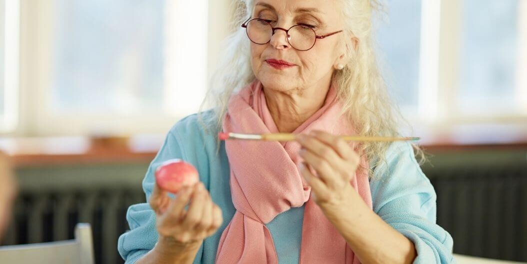 Elderly Woman Enjoying Art Therapy Class at Independent Living Facility