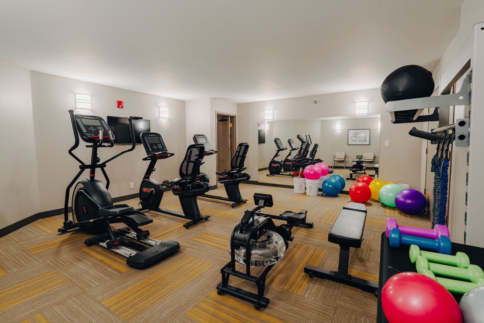 Fitness Center With Cardio Equipment for Elderly Residents at Independent Living Community
