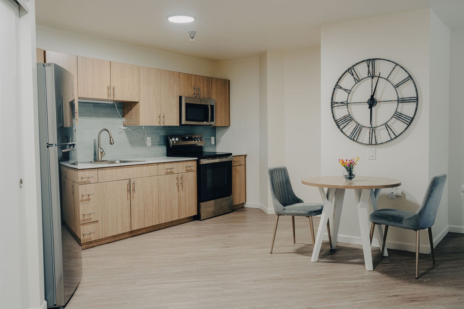 Modern Kitchen and Dining Nook Inside Elderly Apartment at Independent Living Facility