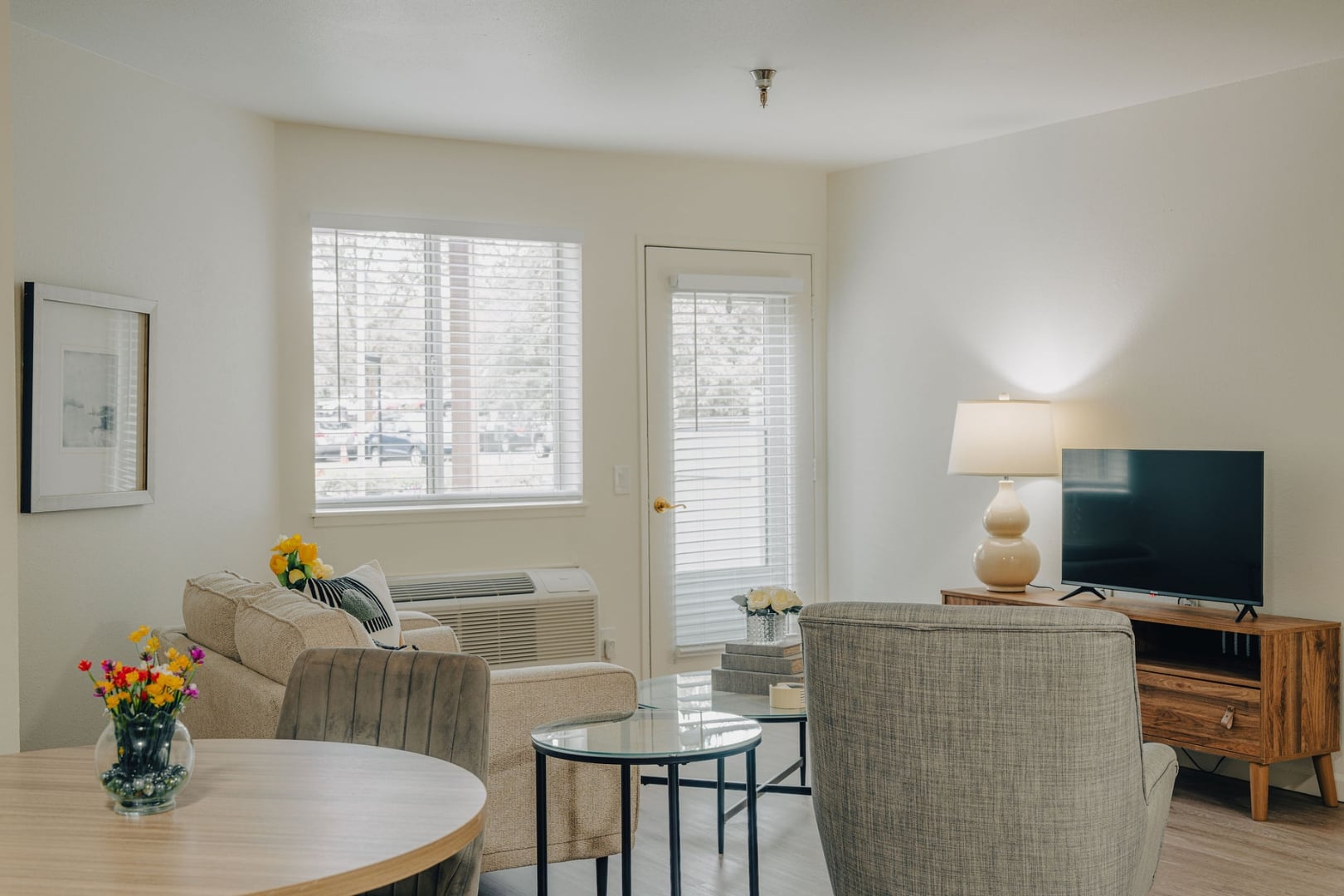 Sunlit Living Room With Comfortable Seating at Independent Living Facility