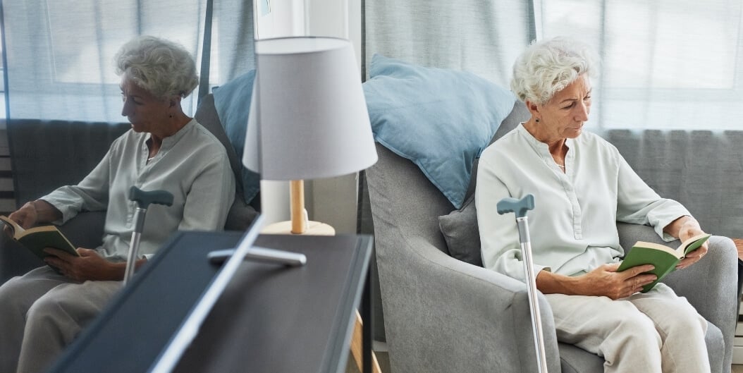 Elderly Woman Reading Quietly Alone at Independent Living Facility